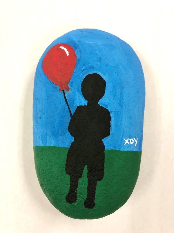 Loneliness - Stone with acrylic paint Created by an unaccompanied refugee child in a shelter program